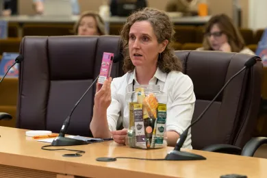 Multnomah County Health Officer Jennifer Vines held up nicotine and tobacco products during the presentation to the Board.