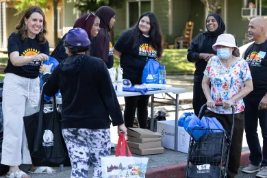 Chair Deborah Kafoury hands out cooling kits with Bienestar de la Familia staff in Cully Wednesday.