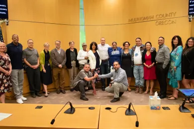 Members of the recovery community celebrate Recovery Month with the Board of Commissioners