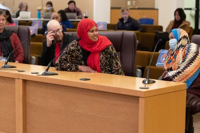 Rent assistance recipients testify before the Board of Commissioners