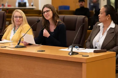 (Left to right): Becky Lillie, Amber Locke, and Sheila Balbin testify before the Board of Commissioners