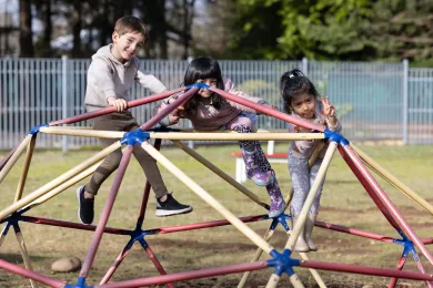 Kids playing on a jungle gym