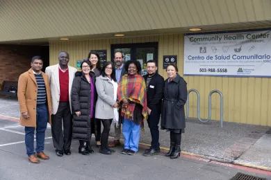 A photo of a group of people standing outside the Rockwood Community Health Center
