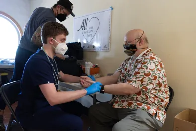 A person receiving health care services at a shelter