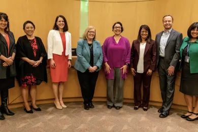 Board of Commissioners pose for a photo with Dan Field and Margi Bradway in the County Boardroom