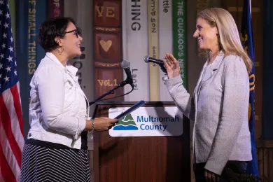 Chair Jessica Vega Pederson swearing in Commissioner Julia Brim-Edwards