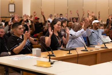 Crowded board room during Recovery month proclamation 
