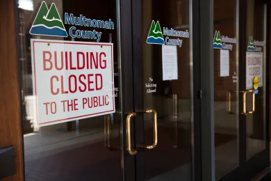 Sign on Multnomah Building indicating it is closed.