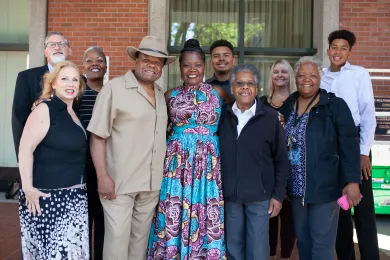 Erika Preuitt poses with family members after Commissioners approve her appointment as DCJ Director.