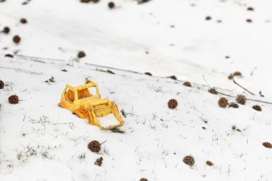 Child's toy plow in deep snow in January 2024
