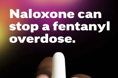 A hand holding naloxone with the text: Expect Fentanyl; Naloxone can stop an overdose; Protect your friends. Visit a student health center to get naloxone and learn how to use it. Or ask an adult you trust.  