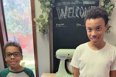 Max (left) and Kingston (right) with their air quality monitors shown between them