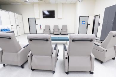 A photo of four grey recliners in a calming health center.