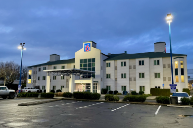 Photo of a Motel 6 at twilight