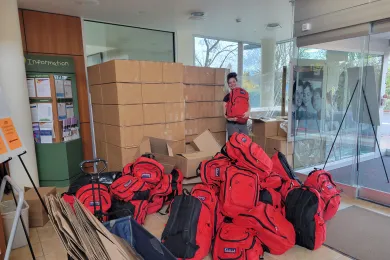 County employee holds one of dozens of emergency preparedness kits distributed over the past year 