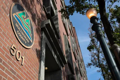The Multnomah Building logo outside the building.
