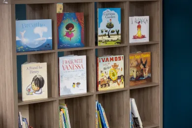 A photo of eight children's books in a bookshelf