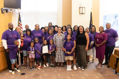Community members and Board of Commissioners in board room for proclamation ceremony. 