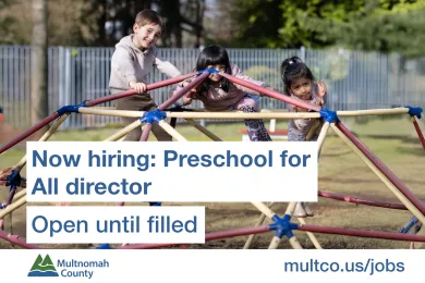 A job announcement for a Preschool for All Director at Multnomah County, featuring a photo of three diverse children playing on a climbing dome. Text reads: "Now hiring: Preschool for All director. Open until filled. multco.us/jobs."