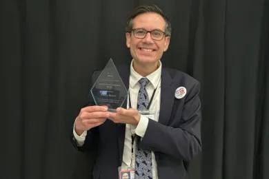 Health Department Deputy Director Valdez Bravo receiving the Oregon Public Health Association’s 2025 Health Equity Champion Award.