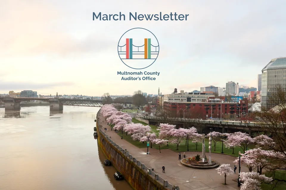 Panoramic view of Portland waterfront with cherry blossom trees