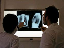 Medical professionals review x-rays