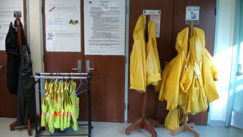 photo of reflective vests and rain coats