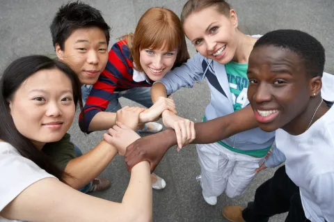 photo of youth holding arms