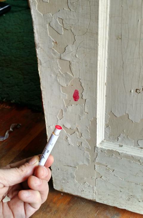 lead test kit showing evidence of lead paint on a door