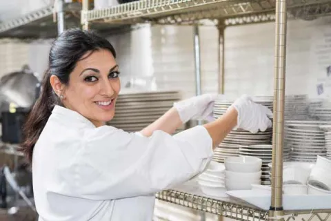 woman stacking dishes
