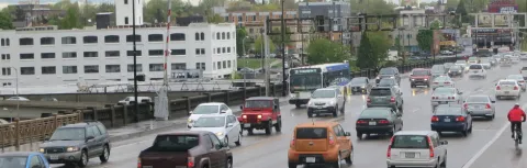 Bike and car traffic on the bridge.