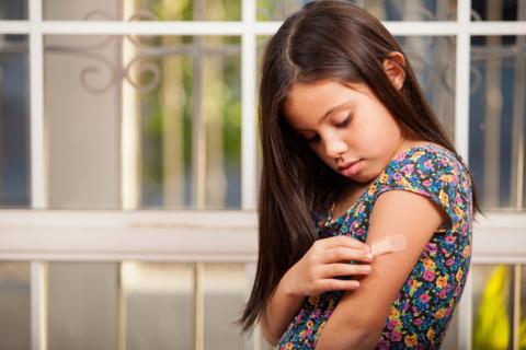 band-aid on a girl's arm