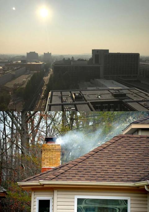 smokey sky over city and smoke coming from a house chimney