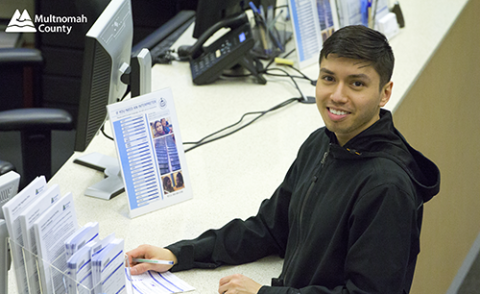 Young man registering to vote at the elections office