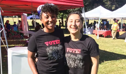 Multnomah County Elections interns attend outdoor outreach event to help people register to vote.