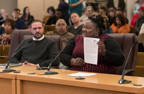 Chair Kafoury’s Chief of Staff Kim Melton displays the draft Implementation plan as Chief Diversity and Equity Officer Ben Duncan looks on.