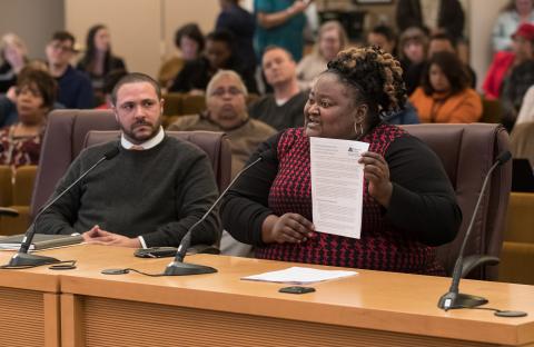 Chair Kafoury’s Chief of Staff Kim Melton displays the draft Implementation plan as Chief Diversity and Equity Officer Ben Duncan looks on.  