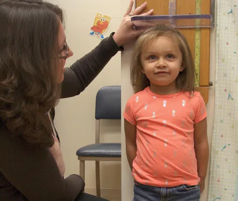 girl being measured at a clinic