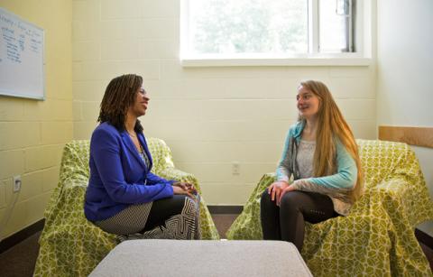 girl talking to a therapist at school