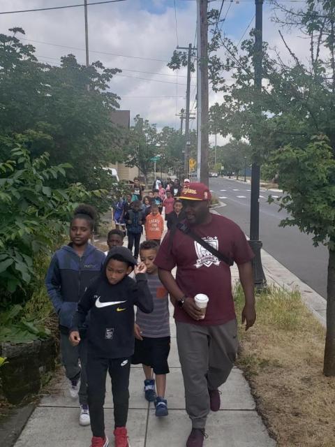 ICB's basketball camp using active transportation during one of their field trips.