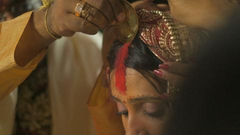 applying sindoor powder in a Hindu ceremony