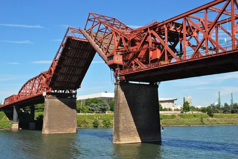 Looking up at the Broadway Bridge as its lift spans open.