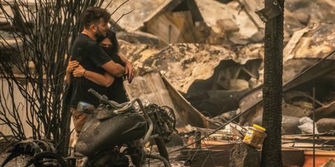 Couple embracing after the wildfires