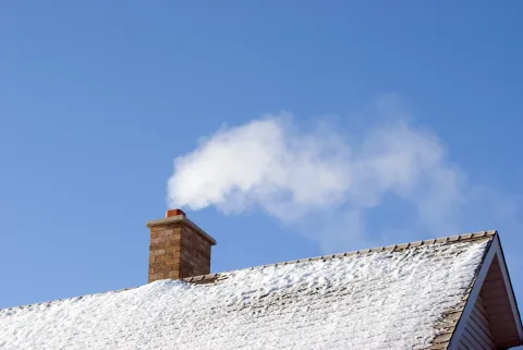 Wood smoke coming out of chimney