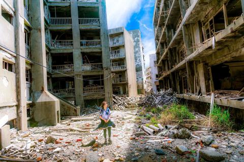 Little girl standing near earthquake debris