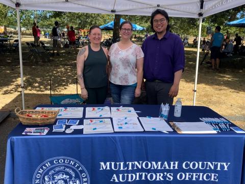 three people standing at Auditor's Office table at Parklane Park