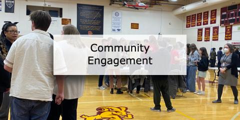 students standing in high school gym