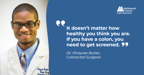 Smiling black doctor in glasses next to a message: It doesn't matter how healthy you are. If you have a colon you need to get screened.