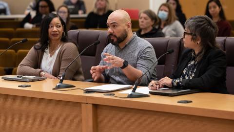 Office of Diversity and Equity Workforce Equity Manager Alejandro Juárez, center, speaks to the Board. He was joined by Chief Diversity and Equity Officer Joy Fowler (left) and Workforce Equity Senior Policy Analyst April Rohman (right).