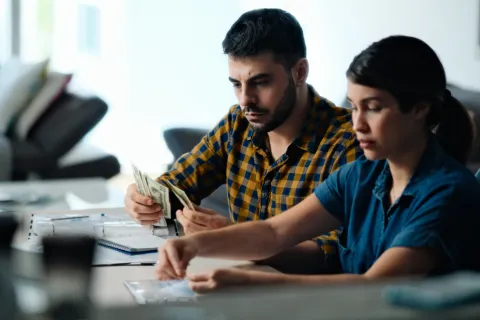 A couple pays utility bills